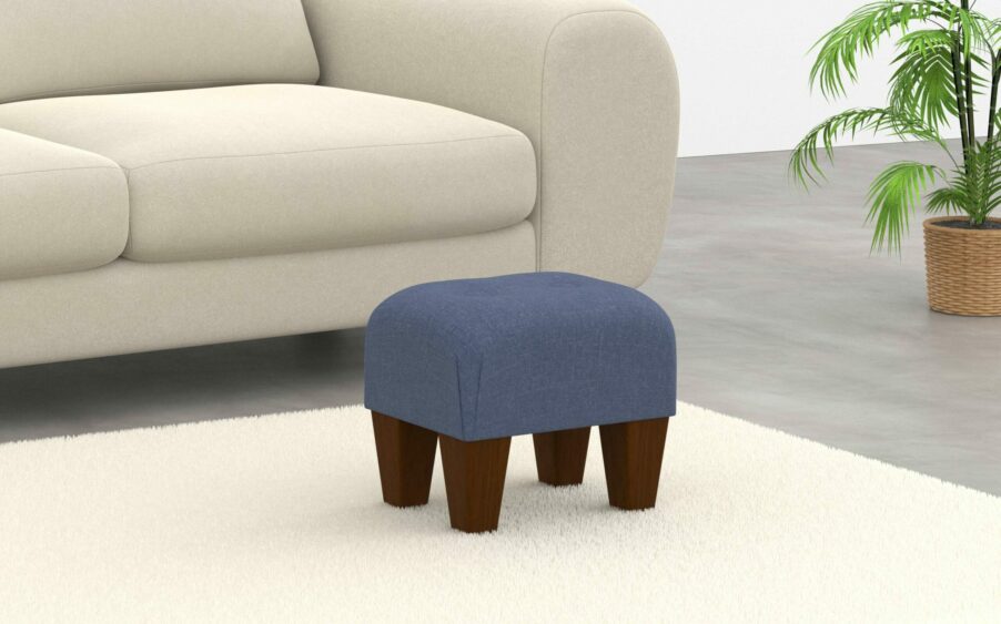 small button footstool in linen blue fabric