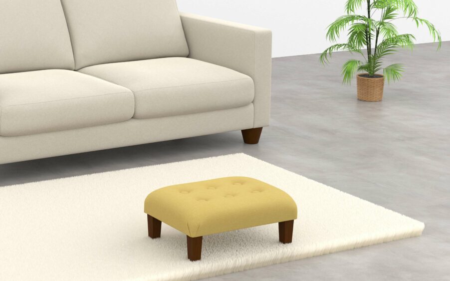 Low rectangle button footstool upholstered in yellow linen fabric with wood legs