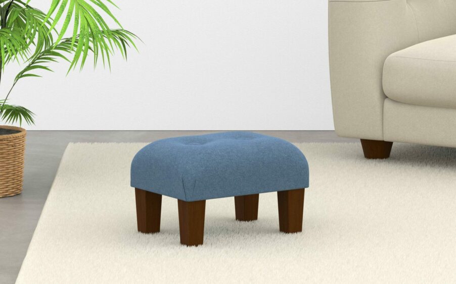 small button footstool in wool light blue fabric