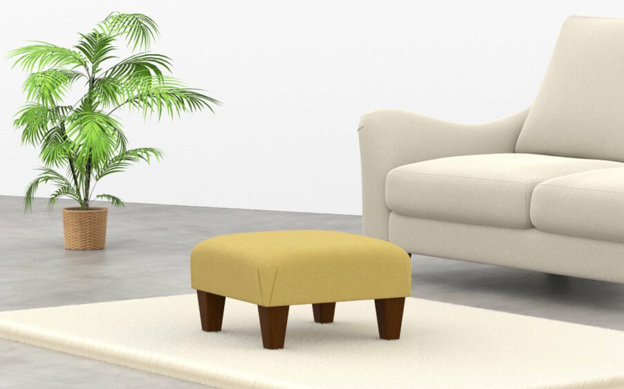 Square low wrap over footstool upholstered in yellow linen fabric with wood legs