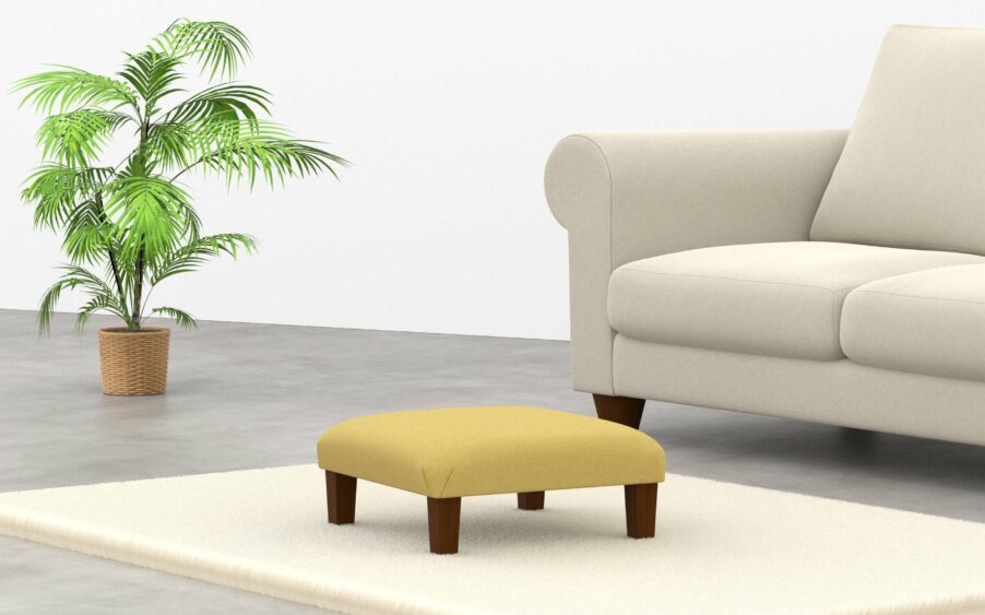 Square low footstool upholstered in yellow linen fabric with wood legs